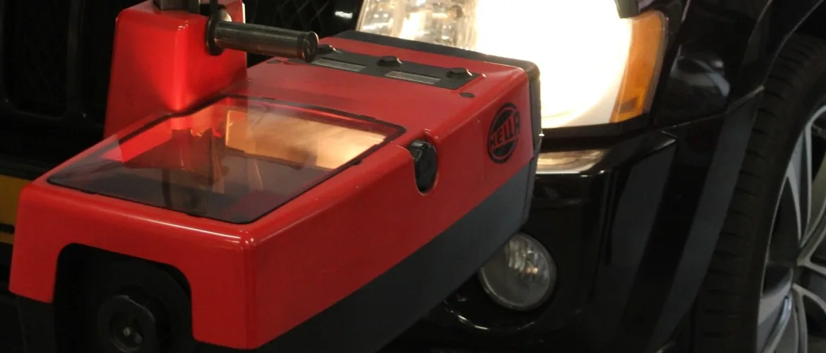 Een koplampafstelapparaat voor de brandende koplamp van een auto